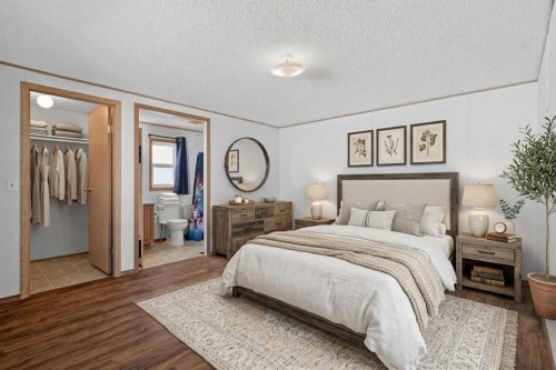 125 Erin Woods Circle Se, Calgary, AB - Indoor Photo Showing Bedroom
