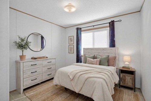125 Erin Woods Circle Se, Calgary, AB - Indoor Photo Showing Bedroom
