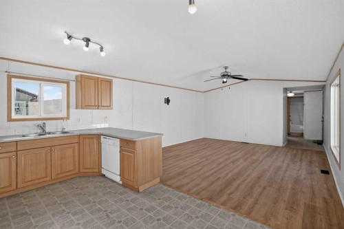 125 Erin Woods Circle Se, Calgary, AB - Indoor Photo Showing Kitchen With Double Sink