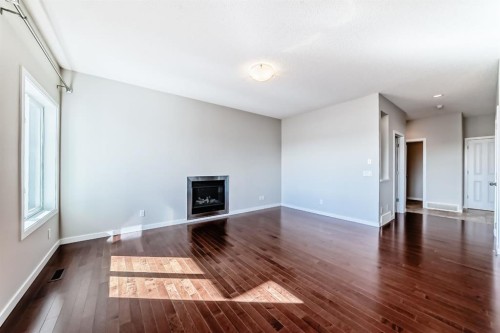 20 Walden Green Se, Calgary, AB - Indoor Photo Showing Other Room With Fireplace