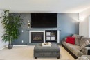 67 Copperfield Rise Se, Calgary, AB  - Indoor Photo Showing Living Room With Fireplace 
