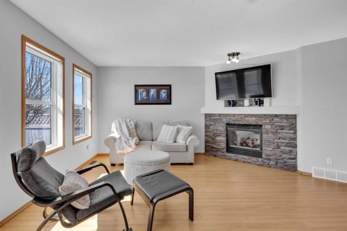 192 Somerglen Common, Calgary, AB - Indoor Photo Showing Living Room With Fireplace