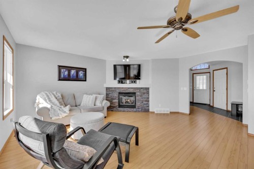 192 Somerglen Common, Calgary, AB - Indoor Photo Showing Living Room With Fireplace