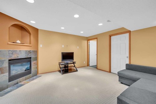 192 Somerglen Common, Calgary, AB - Indoor Photo Showing Other Room With Fireplace