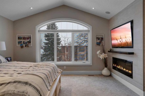 2041 45 Avenue Sw, Calgary, AB - Indoor Photo Showing Bedroom With Fireplace
