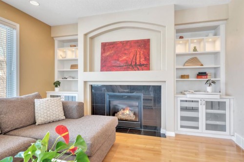 56 Evergreen Crescent Sw, Calgary, AB - Indoor Photo Showing Living Room With Fireplace
