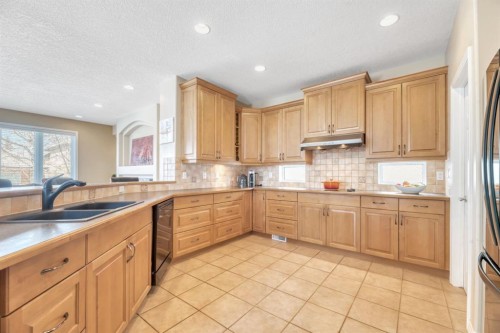 56 Evergreen Crescent Sw, Calgary, AB - Indoor Photo Showing Kitchen With Double Sink