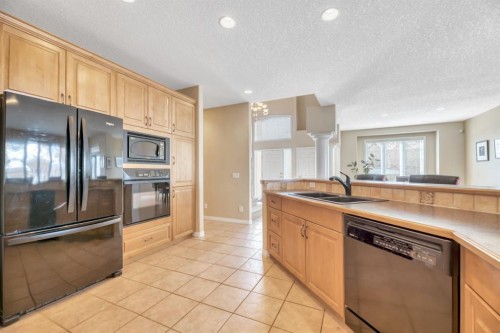 56 Evergreen Crescent Sw, Calgary, AB - Indoor Photo Showing Kitchen With Double Sink