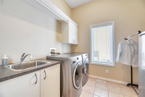 56 Evergreen Crescent Sw, Calgary, AB - Indoor Photo Showing Laundry Room