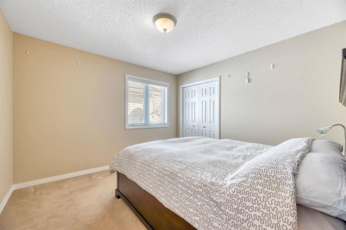 56 Evergreen Crescent Sw, Calgary, AB - Indoor Photo Showing Bedroom