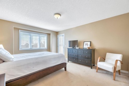 56 Evergreen Crescent Sw, Calgary, AB - Indoor Photo Showing Bedroom