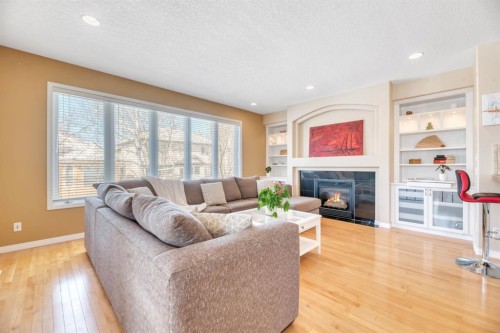 56 Evergreen Crescent Sw, Calgary, AB - Indoor Photo Showing Living Room With Fireplace