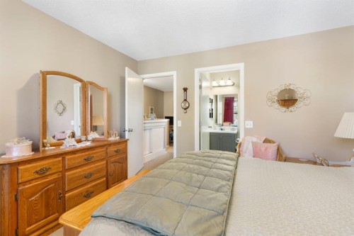 352 Elgin Gardens Se, Calgary, AB - Indoor Photo Showing Bedroom