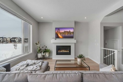 23 Savoy Terrace Se, Calgary, AB - Indoor Photo Showing Living Room With Fireplace