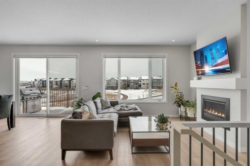 23 Savoy Terrace Se, Calgary, AB - Indoor Photo Showing Living Room With Fireplace