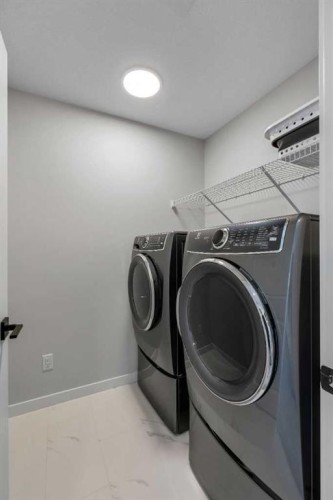 23 Savoy Terrace Se, Calgary, AB - Indoor Photo Showing Laundry Room
