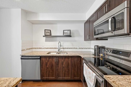 2102-279 Copperpond Common Se, Calgary, AB - Indoor Photo Showing Kitchen With Stainless Steel Kitchen With Double Sink With Upgraded Kitchen