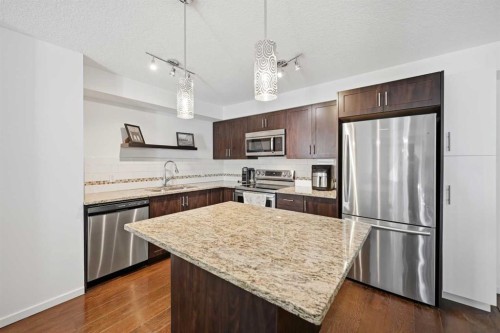 2102-279 Copperpond Common Se, Calgary, AB - Indoor Photo Showing Kitchen With Stainless Steel Kitchen With Upgraded Kitchen