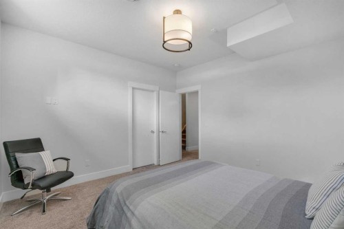 1148 Radnor Avenue Ne, Calgary, AB - Indoor Photo Showing Bedroom