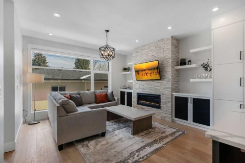 1148 Radnor Avenue Ne, Calgary, AB - Indoor Photo Showing Living Room With Fireplace