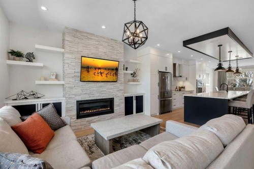 1148 Radnor Avenue Ne, Calgary, AB - Indoor Photo Showing Living Room With Fireplace