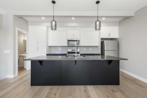 8 Waterford Glen, Chestermere, AB - Indoor Photo Showing Kitchen With Upgraded Kitchen