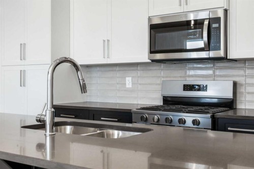 8 Waterford Glen, Chestermere, AB - Indoor Photo Showing Kitchen With Double Sink With Upgraded Kitchen