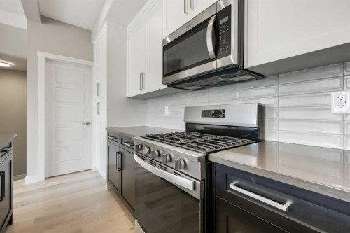 8 Waterford Glen, Chestermere, AB - Indoor Photo Showing Kitchen With Upgraded Kitchen