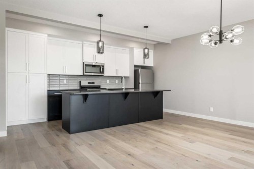 8 Waterford Glen, Chestermere, AB - Indoor Photo Showing Kitchen With Upgraded Kitchen
