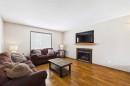 115 Citadel Mesa Close Nw, Calgary, AB  - Indoor Photo Showing Living Room With Fireplace 