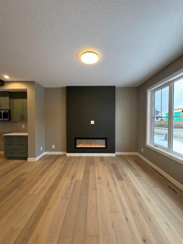 271 Waterford Heights, Chestermere, AB - Indoor Photo Showing Living Room With Fireplace