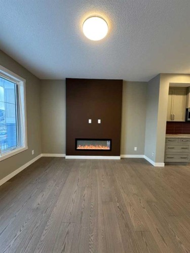 219 Waterford Heights, Chestermere, AB - Indoor With Fireplace
