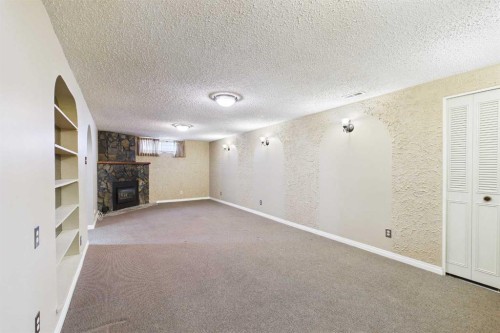 307 Wascana Road Se, Calgary, AB - Indoor Photo Showing Other Room With Fireplace