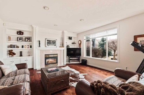 70 Patterson Close Sw, Calgary, AB - Indoor Photo Showing Living Room With Fireplace