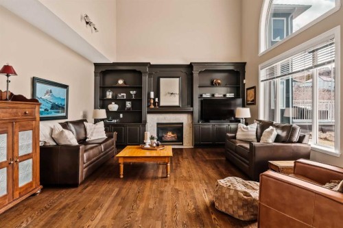 70 Patterson Close Sw, Calgary, AB - Indoor Photo Showing Living Room With Fireplace