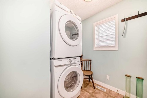 67 Cimarron Meadows Bay, Okotoks, AB - Indoor Photo Showing Laundry Room