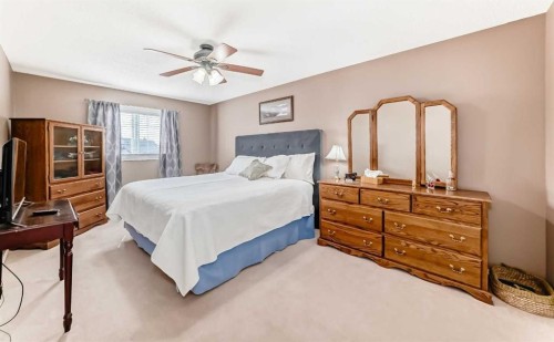 67 Cimarron Meadows Bay, Okotoks, AB - Indoor Photo Showing Bedroom