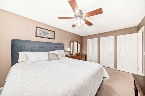 67 Cimarron Meadows Bay, Okotoks, AB - Indoor Photo Showing Bedroom