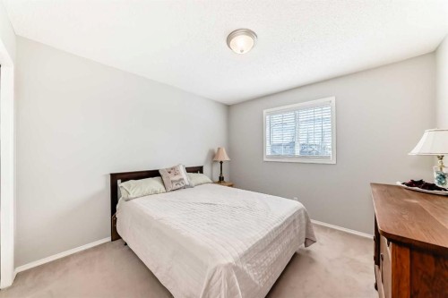 67 Cimarron Meadows Bay, Okotoks, AB - Indoor Photo Showing Bedroom