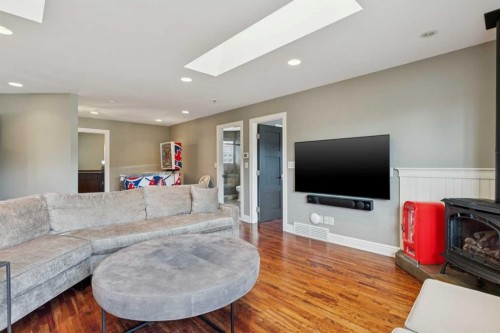 58 Scimitar View Nw, Calgary, AB - Indoor Photo Showing Living Room With Fireplace