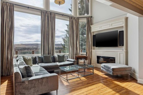 58 Scimitar View Nw, Calgary, AB - Indoor Photo Showing Living Room With Fireplace