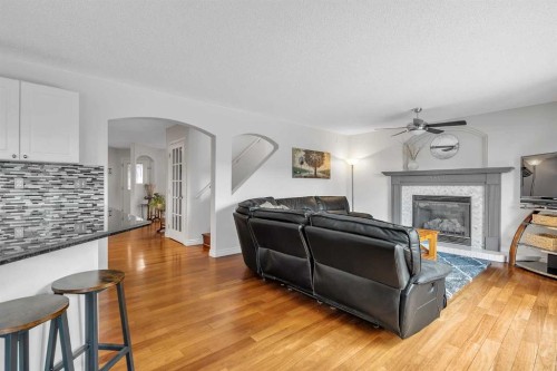92 Bow Ridge Crescent, Cochrane, AB - Indoor Photo Showing Living Room With Fireplace