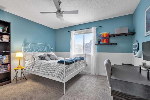 92 Bow Ridge Crescent, Cochrane, AB - Indoor Photo Showing Bedroom