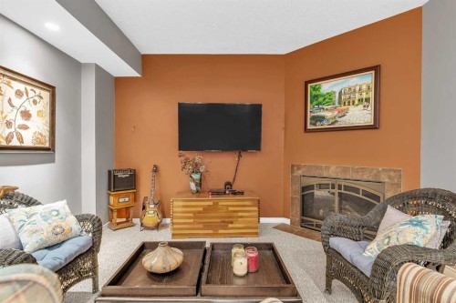 92 Bow Ridge Crescent, Cochrane, AB - Indoor Photo Showing Living Room With Fireplace
