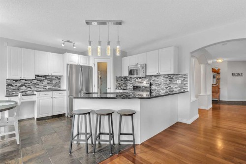 92 Bow Ridge Crescent, Cochrane, AB - Indoor Photo Showing Kitchen With Upgraded Kitchen