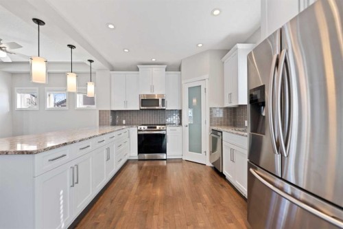 83 Drake Landing Loop, Okotoks, AB - Indoor Photo Showing Kitchen With Upgraded Kitchen