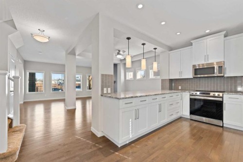 83 Drake Landing Loop, Okotoks, AB - Indoor Photo Showing Kitchen With Upgraded Kitchen