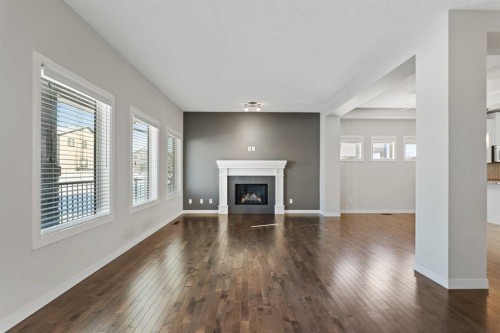 83 Drake Landing Loop, Okotoks, AB - Indoor Photo Showing Living Room With Fireplace