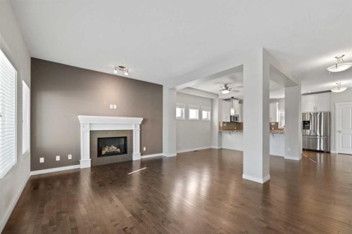 83 Drake Landing Loop, Okotoks, AB - Indoor Photo Showing Living Room With Fireplace
