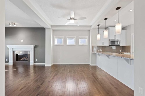 83 Drake Landing Loop, Okotoks, AB - Indoor With Fireplace